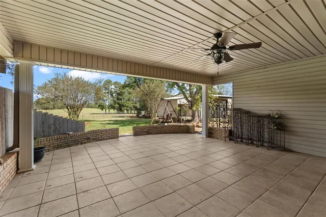 a view of a house with a yard porch and sitting area