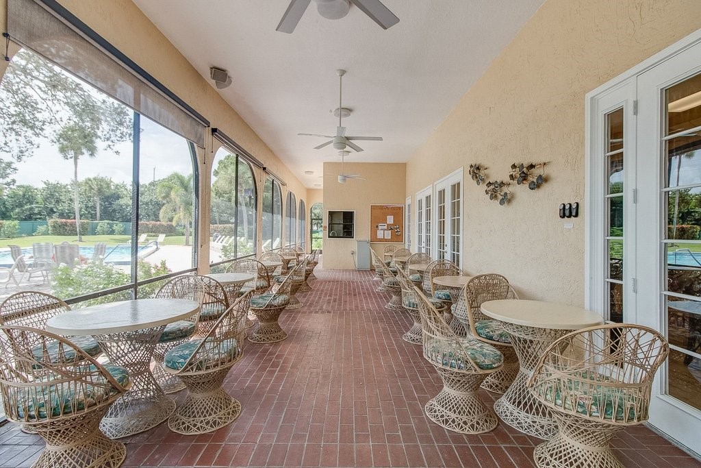 9637 Riverside Drive, Unit 3 Sebastian, FL 32958 - Photo 35 of 36 a living room with furniture and a large window