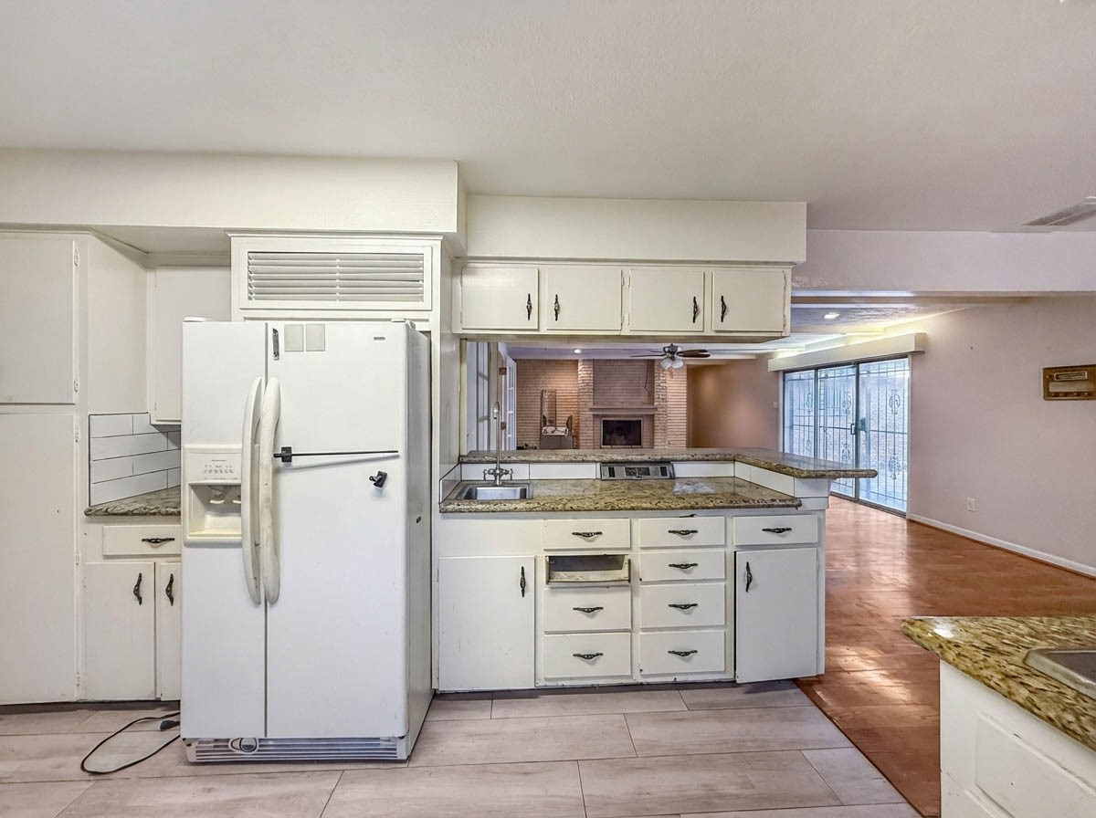 8219 Colgate Street Houston, TX 77061 - Photo 11 of 39 a kitchen with stainless steel appliances a stove and a refrigerator