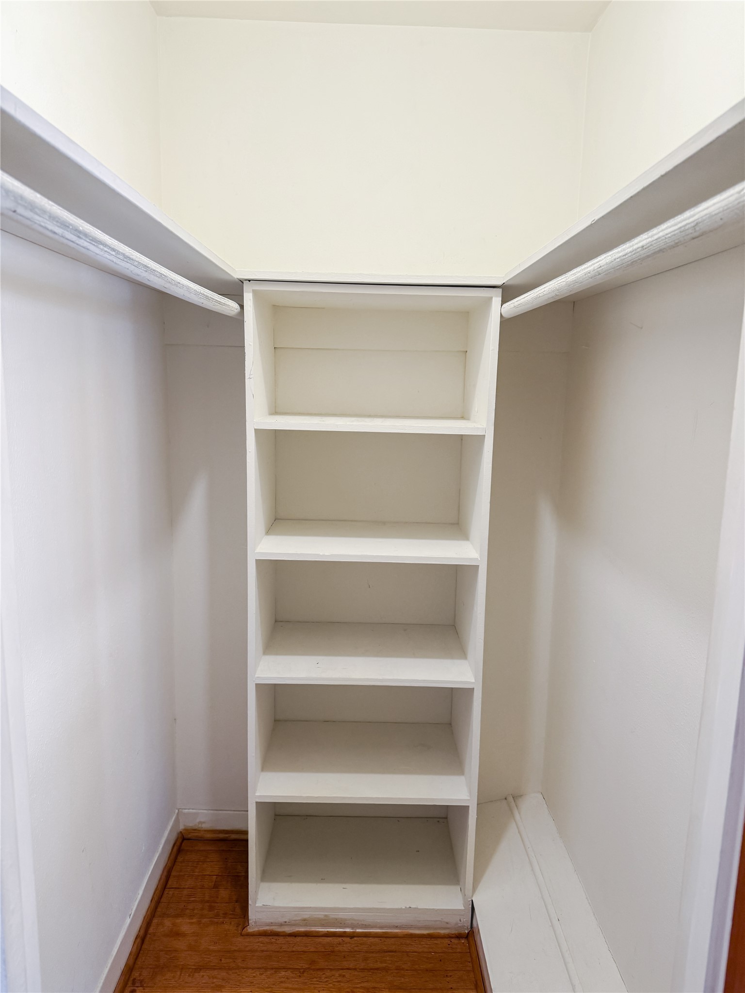 8219 Colgate Street Houston, TX 77061 - Photo 19 of 39 a view of walk in closet with empty racks