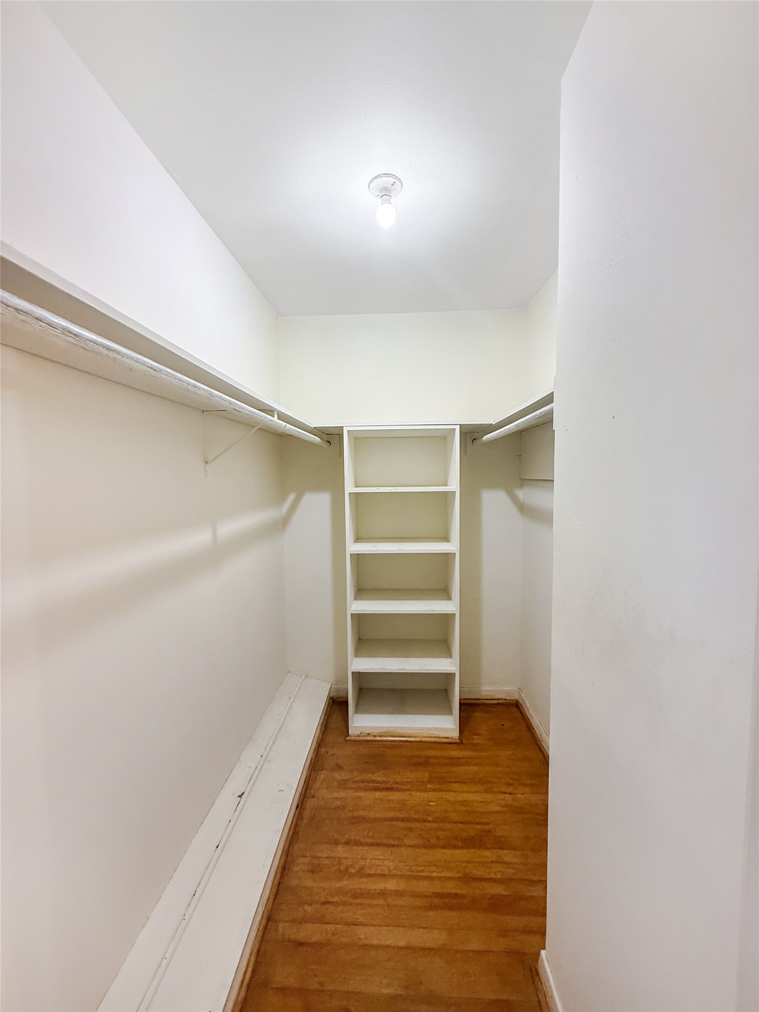 8219 Colgate Street Houston, TX 77061 - Photo 20 of 39 a view of walk in closet with empty racks