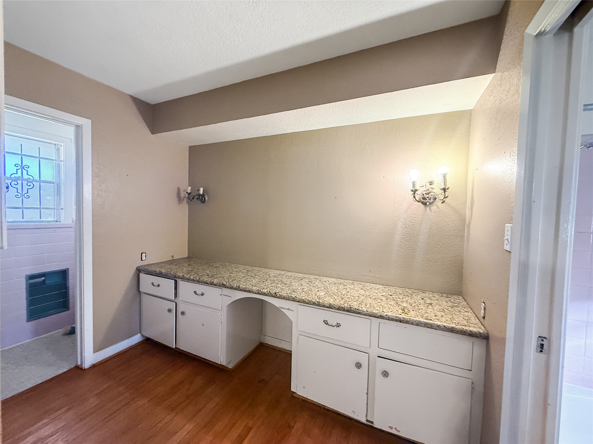 8219 Colgate Street Houston, TX 77061 - Photo 21 of 39 a spacious bathroom with a granite countertop sink and a mirror