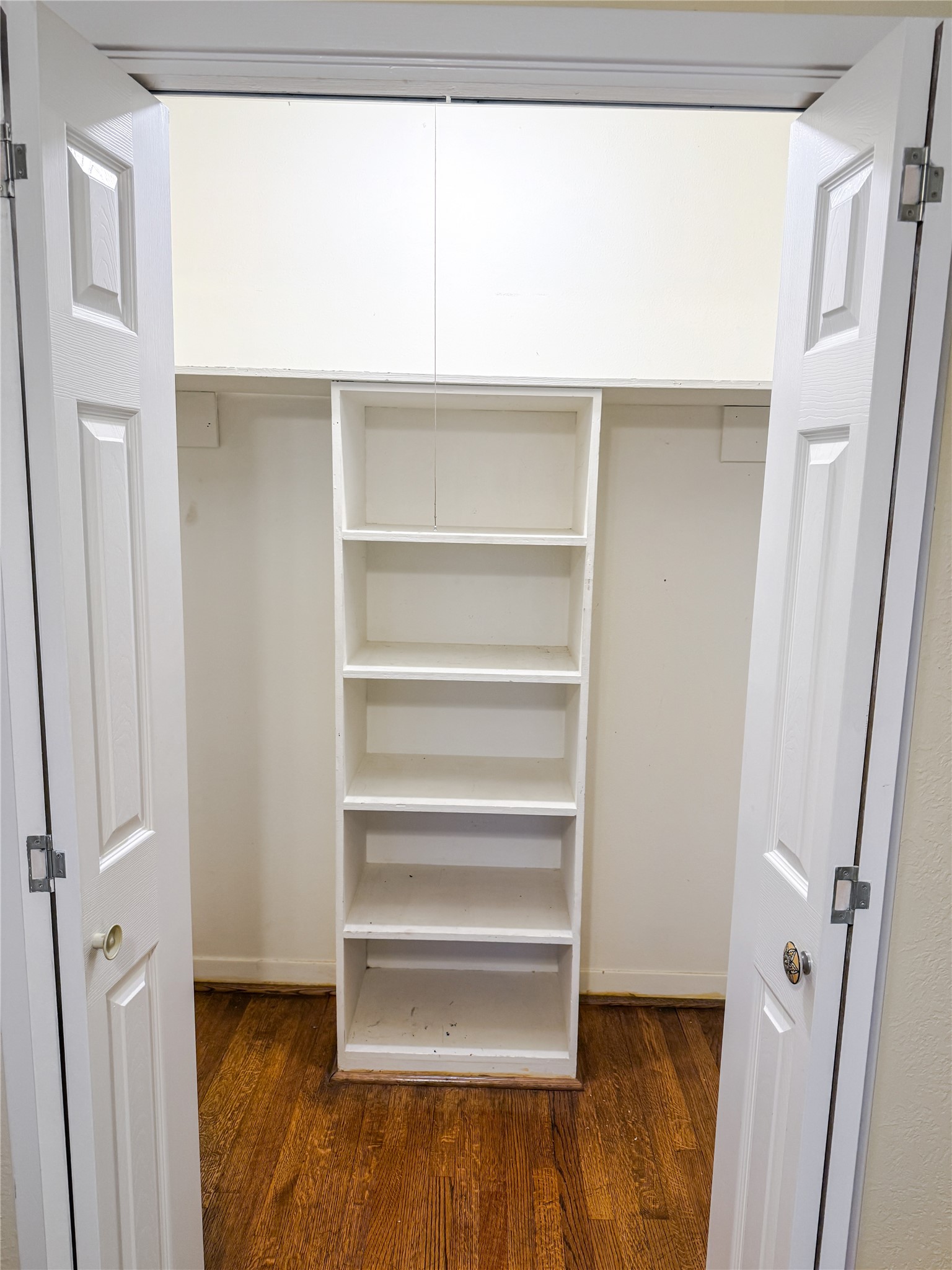 8219 Colgate Street Houston, TX 77061 - Photo 30 of 39 a view of walk in closet with empty racks