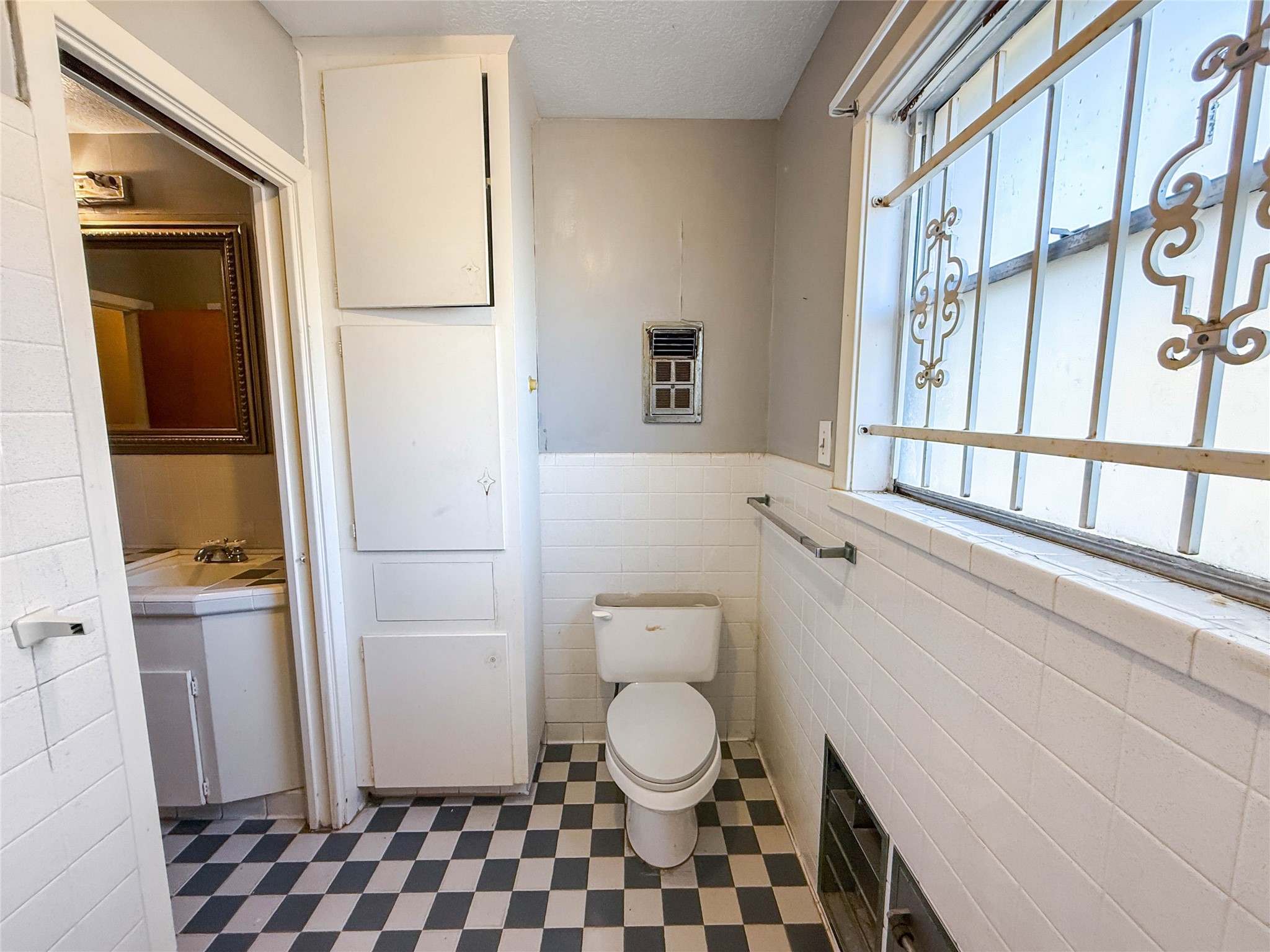 8219 Colgate Street Houston, TX 77061 - Photo 34 of 39 a bathroom with a toilet and a shower