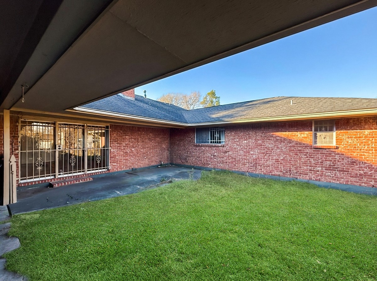 8219 Colgate Street Houston, TX 77061 - Photo 37 of 39 a backyard of a house with lots of green space and outdoor seating
