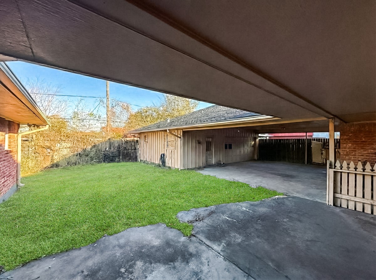 8219 Colgate Street Houston, TX 77061 - Photo 39 of 39 a view of a porch with a yard