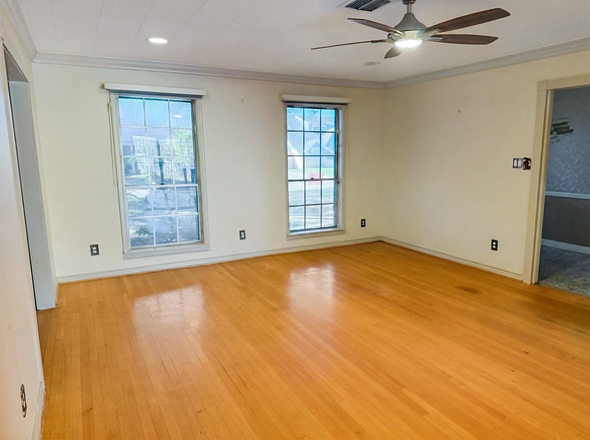 8219 Colgate Street Houston, TX 77061 - Photo 6 of 39 a view of empty room with window and ceiling fan