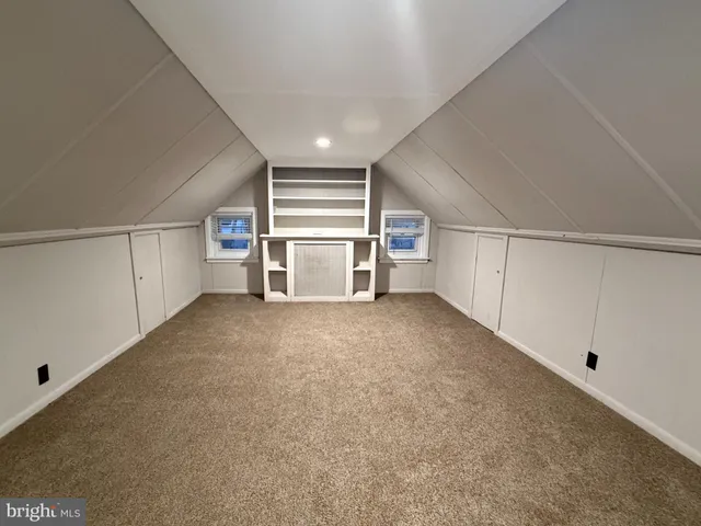 a view of a livingroom with furniture and a window