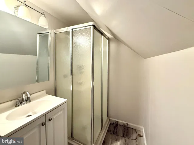 a bathroom with a sink and mirror