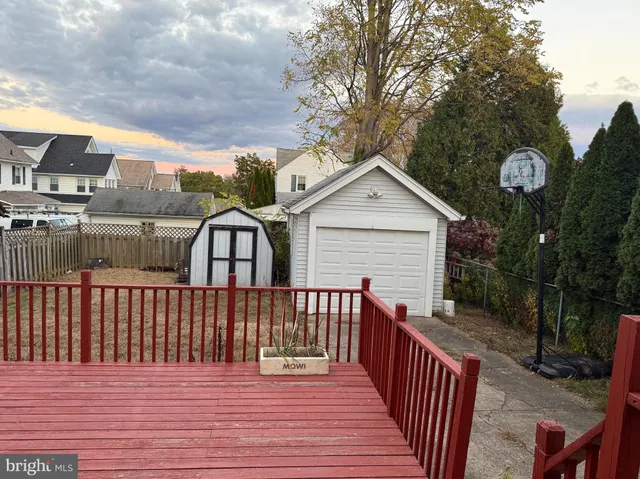 a view of a wooden deck with a yard