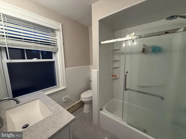 a bathroom with a tub and a sink