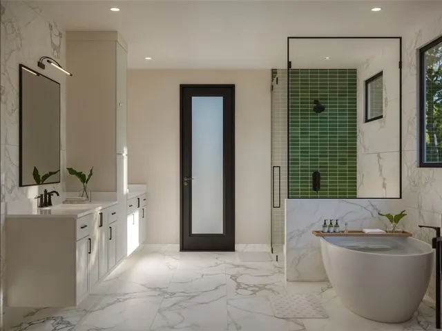 a spacious bathroom with a tub sink and mirror