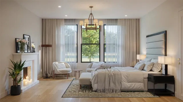 a spacious bedroom with a balcony a bed and a chandelier