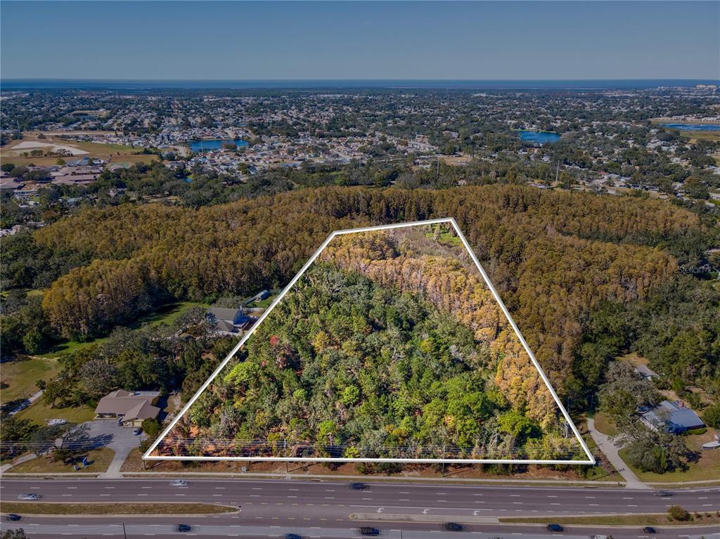 Little Road New Port Richey, FL 34654 - Photo 5 of 5 an aerial view of a house with a yard