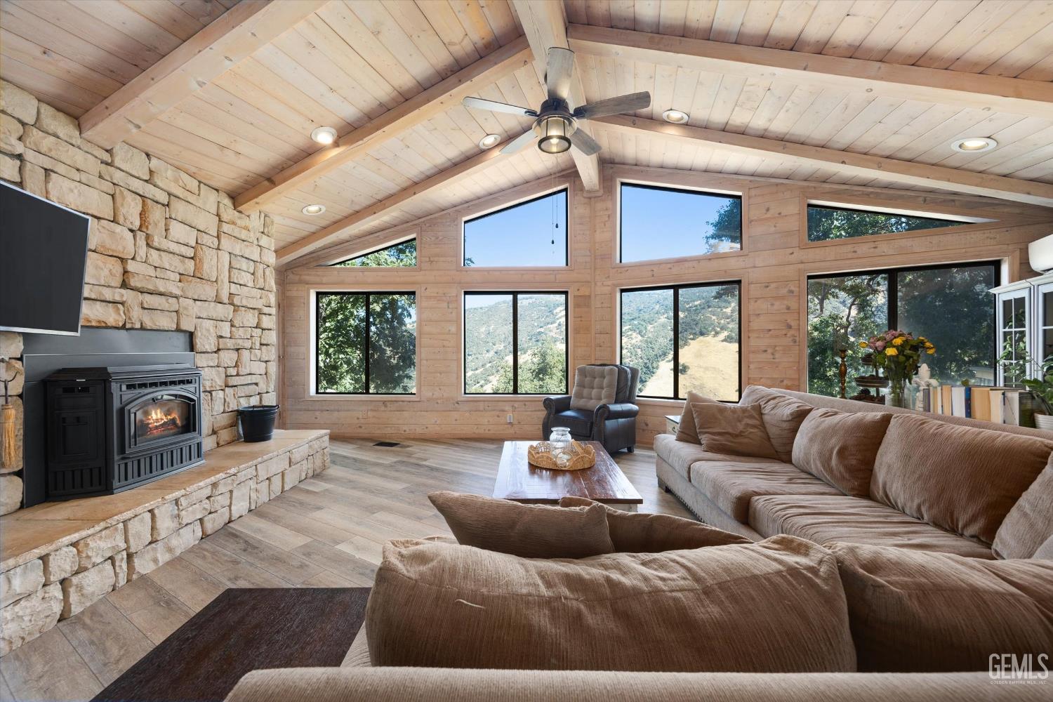 Undisclosed Address Tehachapi, CA 93561 - Photo 2 of 62 a living room with furniture a fireplace and a flat screen tv
