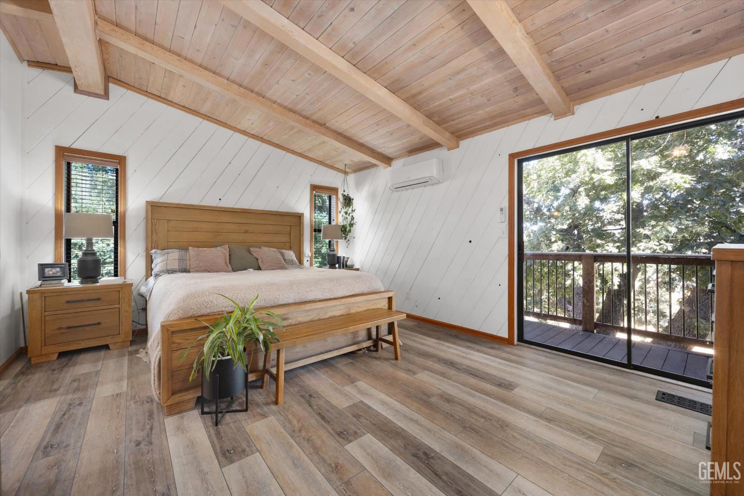 Undisclosed Address Tehachapi, CA 93561 - Photo 34 of 62 a bedroom with a bed and wooden floor