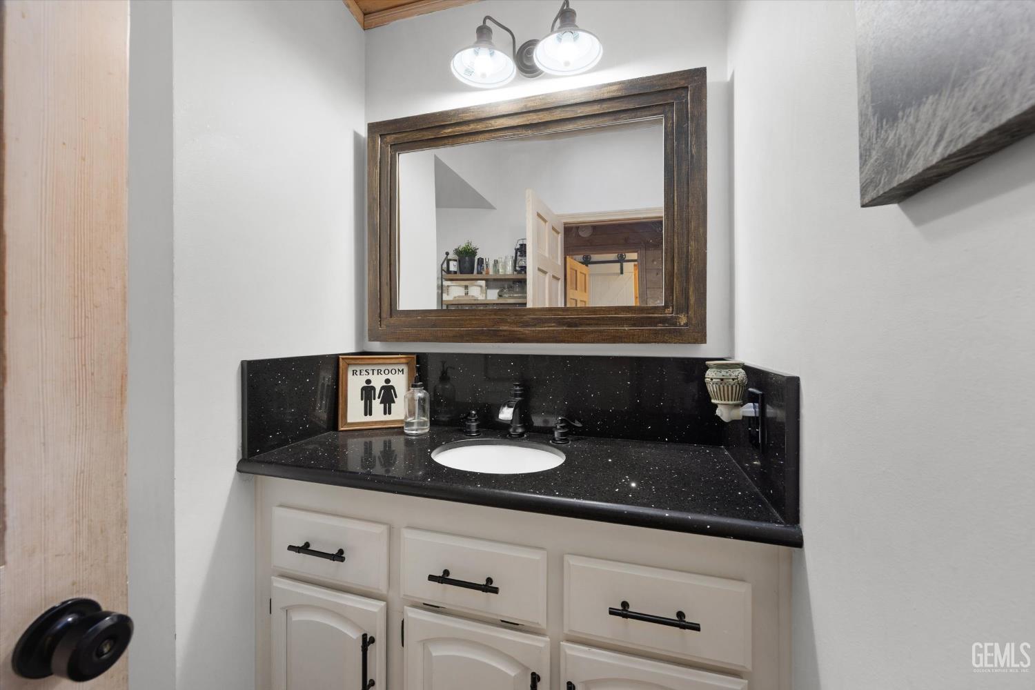 Undisclosed Address Tehachapi, CA 93561 - Photo 48 of 62 a bathroom with a sink and a mirror