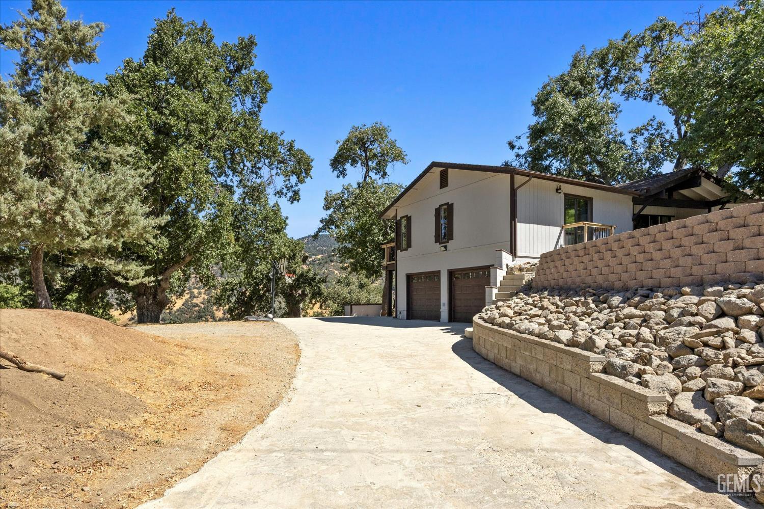 Undisclosed Address Tehachapi, CA 93561 - Photo 57 of 62 a front view of a house with a yard covered with snow