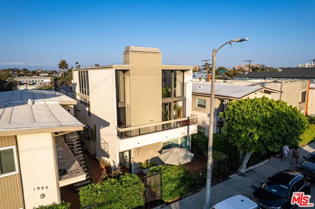 an aerial view of a multi story parking building