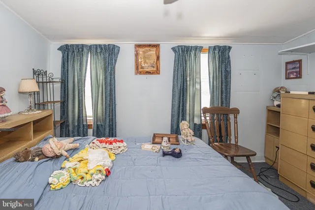 a bedroom with bed and a dresser