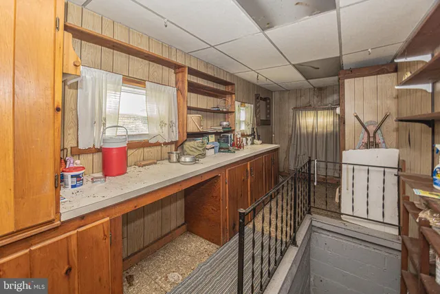 a kitchen with stainless steel appliances granite countertop sink stove and cabinets