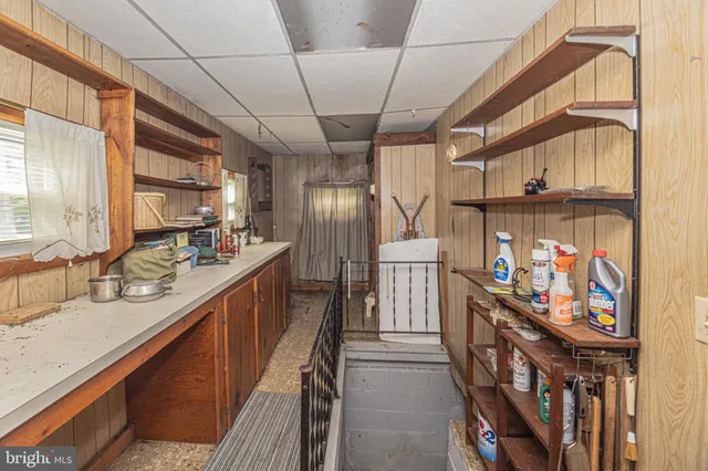 a view of a hallway with stairs