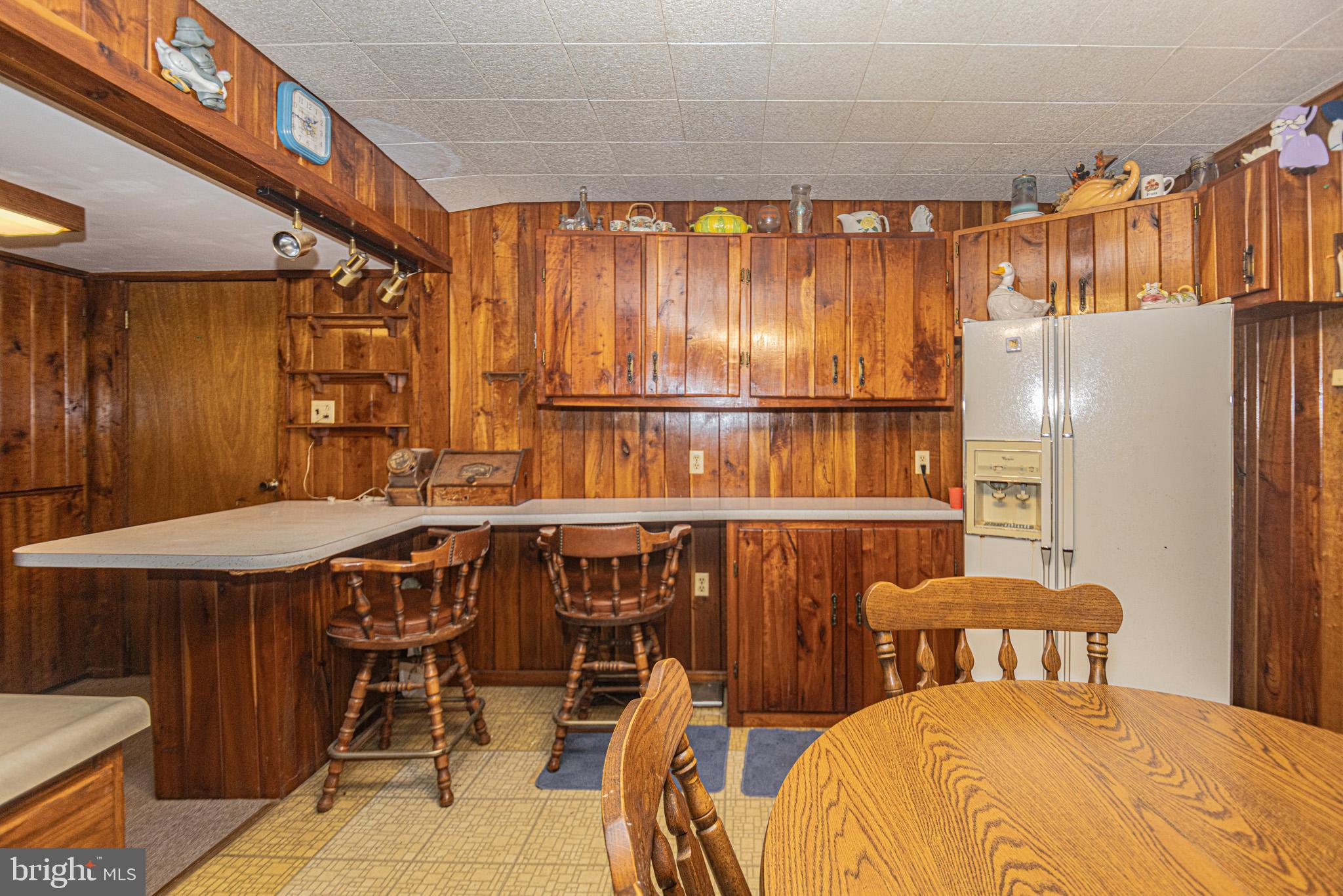 12376 Friendsville Road Friendsville, MD 21531 - Photo 17 of 37 a bedroom with a bed and a table chair