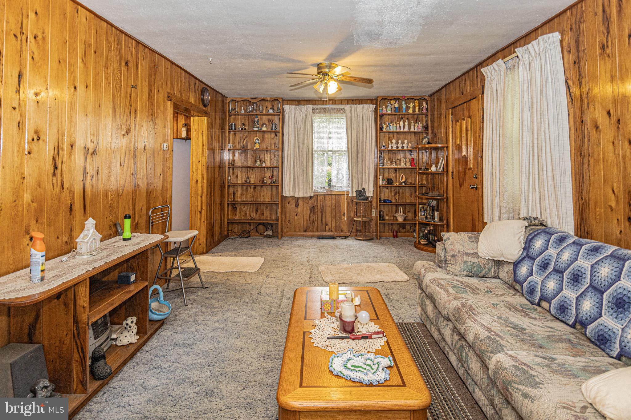 12376 Friendsville Road Friendsville, MD 21531 - Photo 24 of 37 a living room with furniture and a large window