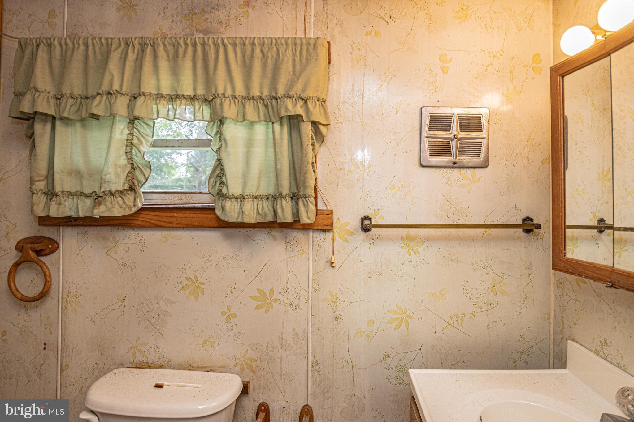 12376 Friendsville Road Friendsville, MD 21531 - Photo 26 of 37 a bathroom with a toilet sink and shower