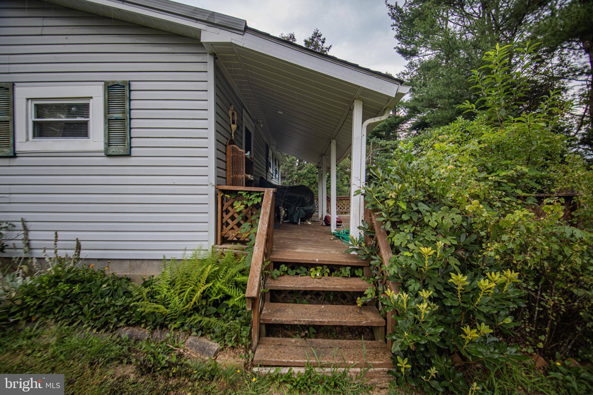 12376 Friendsville Road Friendsville, MD 21531 - Photo 30 of 37 a front view of a house with a yard