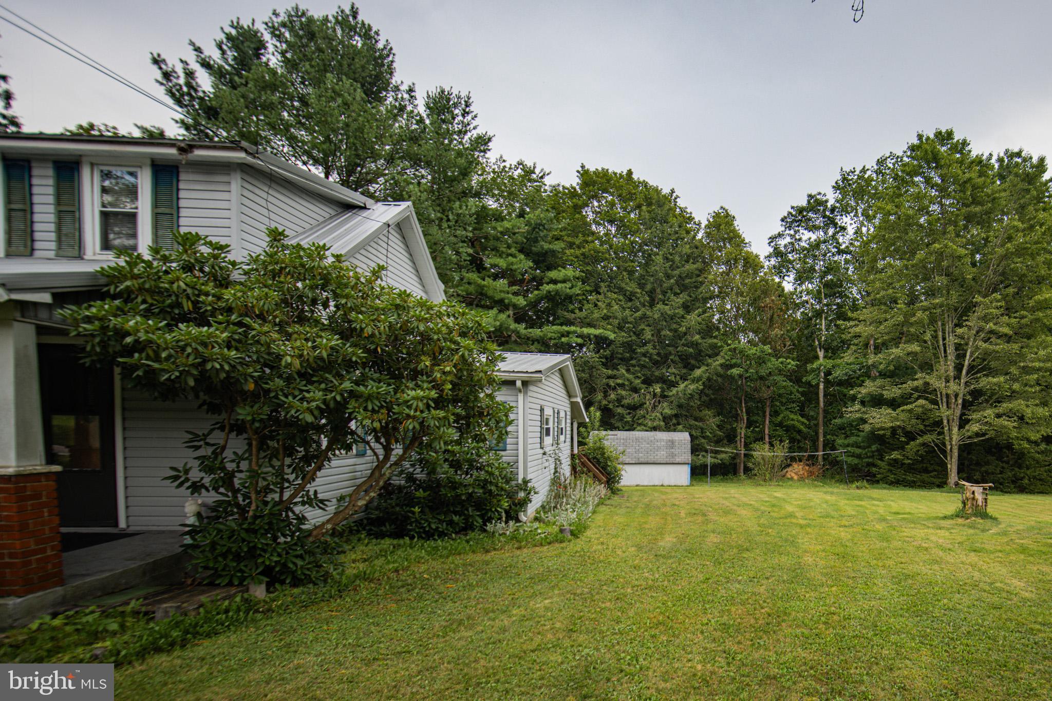 12376 Friendsville Road Friendsville, MD 21531 - Photo 3 of 37 a house view with a garden space
