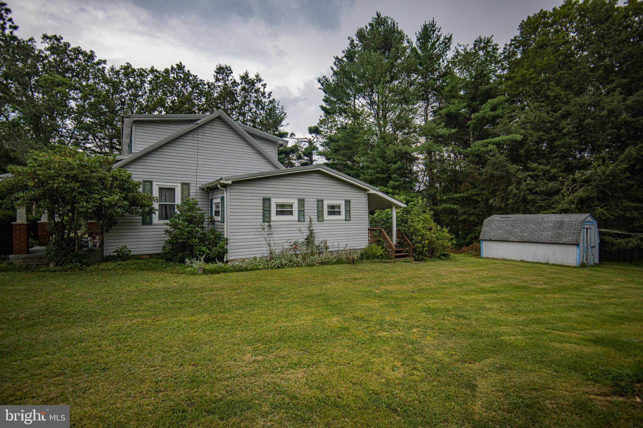 12376 Friendsville Road Friendsville, MD 21531 - Photo 31 of 37 a front view of house with yard and trees