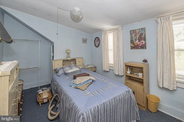 a bedroom with furniture and a fireplace