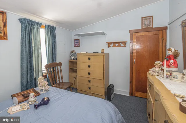 a bedroom with a bed and furniture