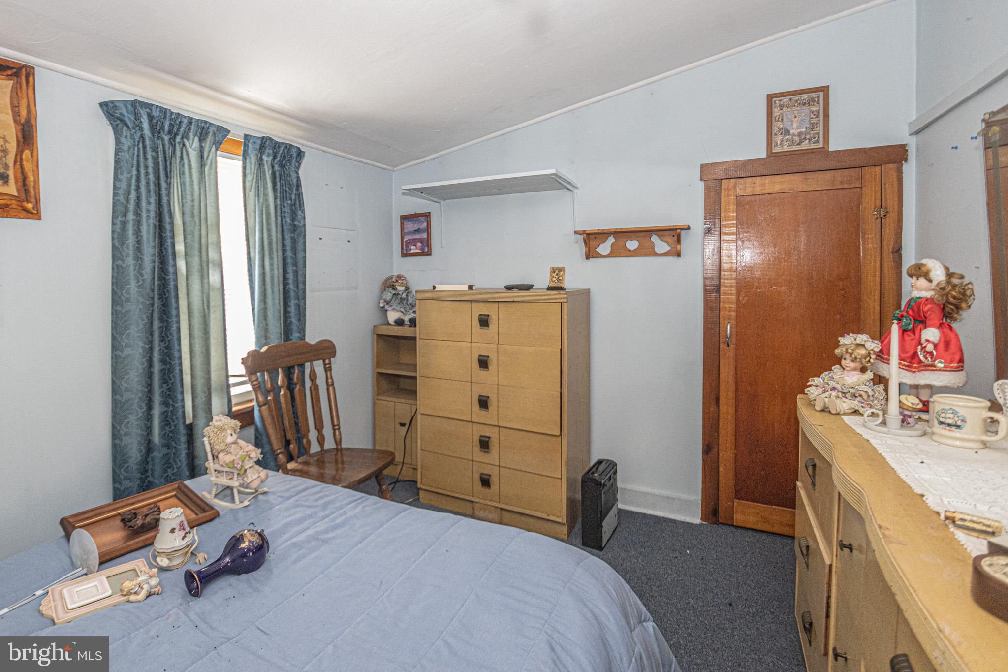 12376 Friendsville Road Friendsville, MD 21531 - Photo 10 of 37 a bedroom with a bed and furniture