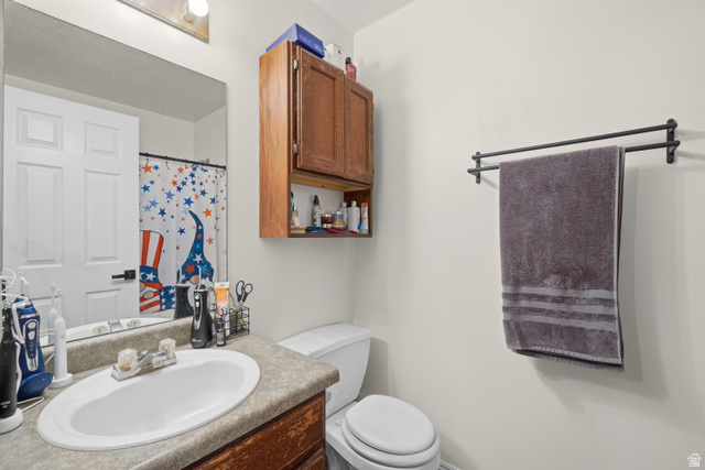 2135 East White Pine Road Eagle Mountain, UT 84005 - Photo 16 of 23 Bathroom vanity with an oval undermount sink and a speckled countertop