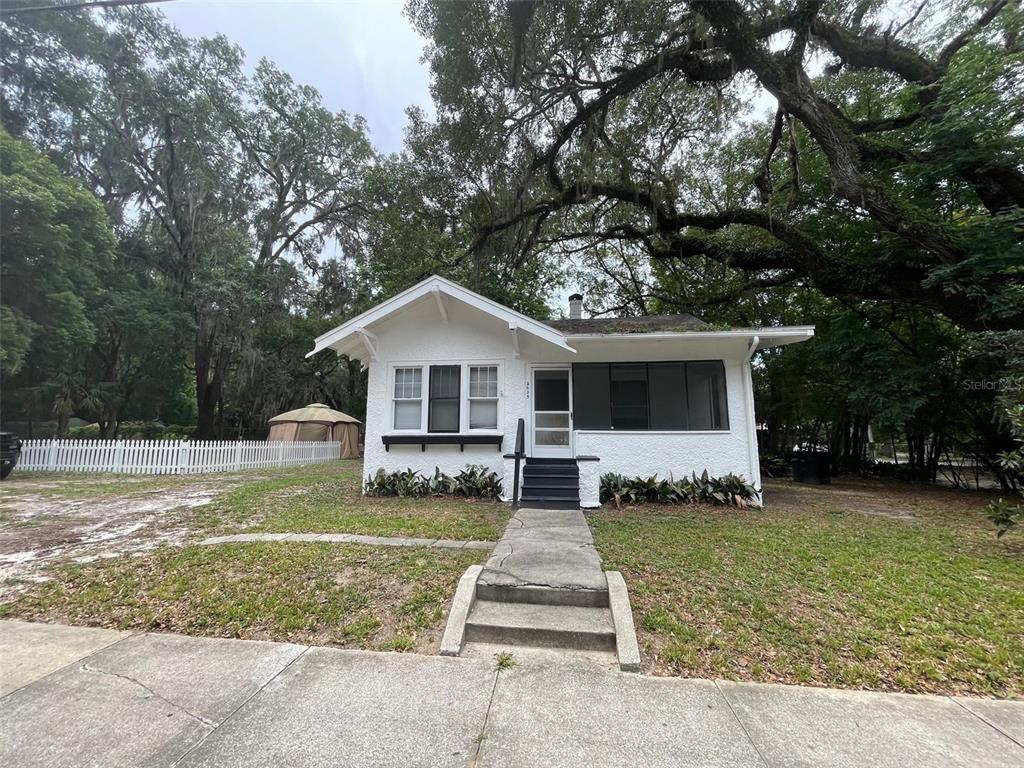2635 West University Avenue Gainesville, FL 32607 - Photo 1 of 15 a front view of a house with a yard