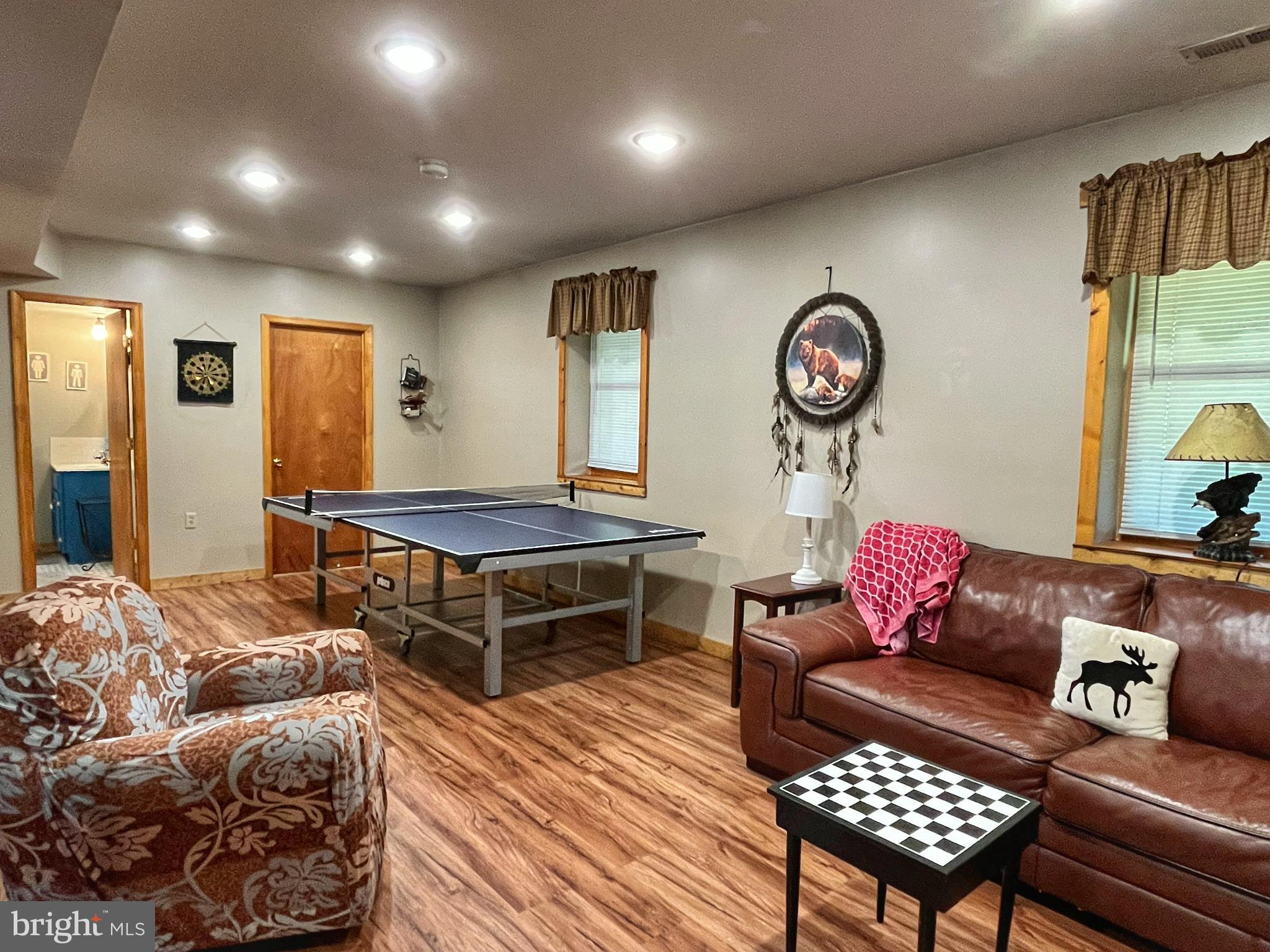 5532 Page Valley Road Luray, VA 22835 - Photo 12 of 42 a living room with furniture a rug and a window