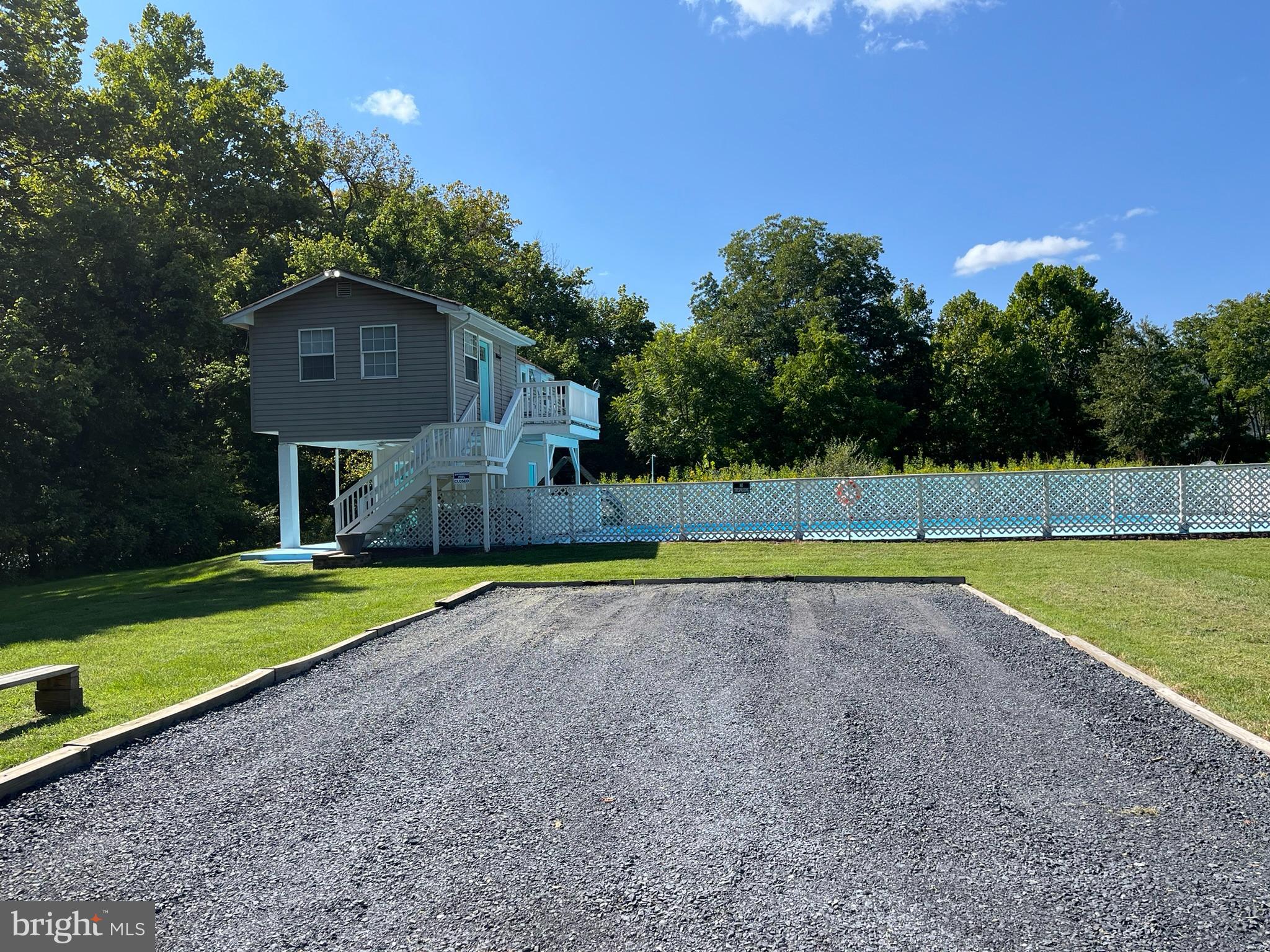 5532 Page Valley Road Luray, VA 22835 - Photo 24 of 42 a view of a swimming pool with an outdoor space and seating area