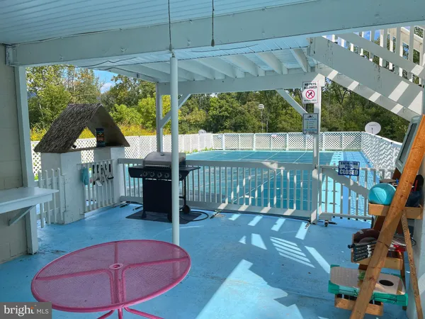 a view of a backyard with sitting area