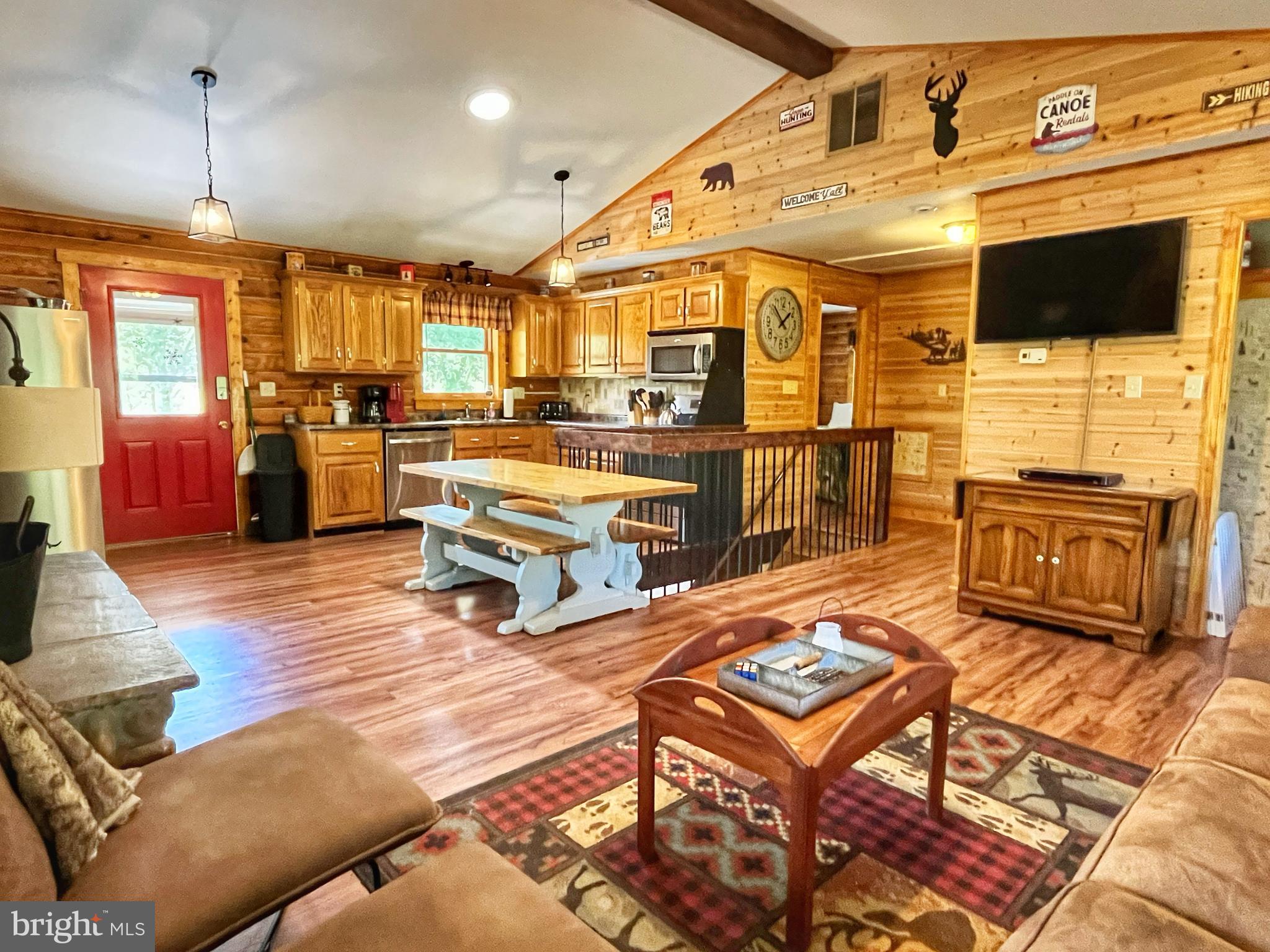 5532 Page Valley Road Luray, VA 22835 - Photo 5 of 42 a living room with patio furniture and a flat screen tv
