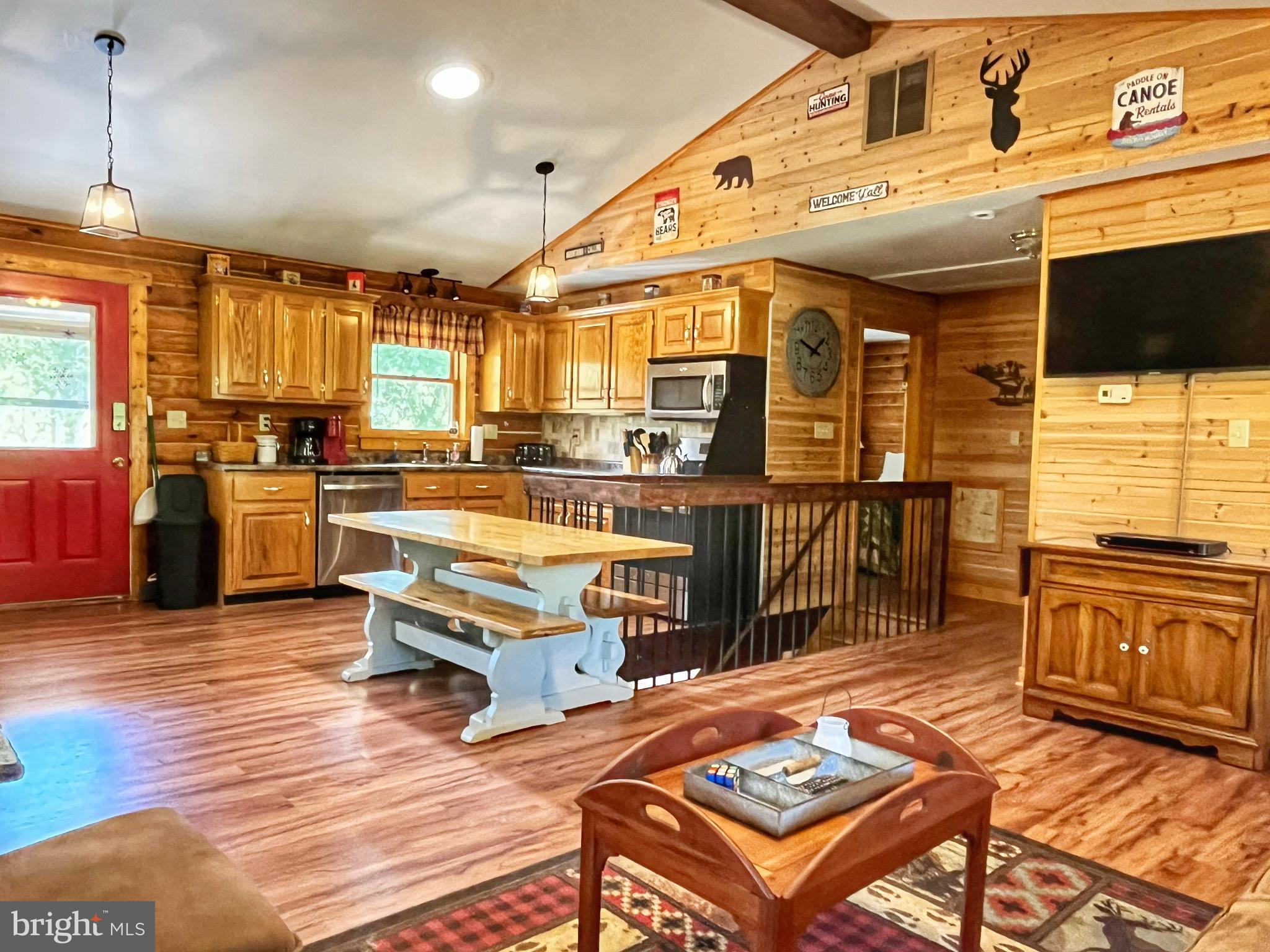5532 Page Valley Road Luray, VA 22835 - Photo 7 of 42 a living room with stainless steel appliances kitchen island granite countertop a stove and a view of living room