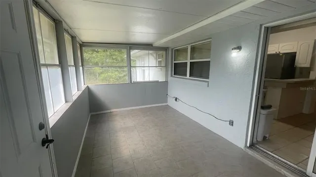 a view of an empty room and window