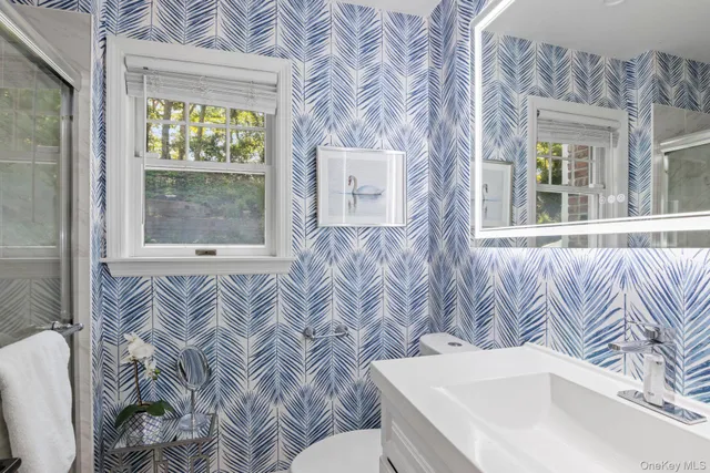 a bedroom with a bed a couch and dresser