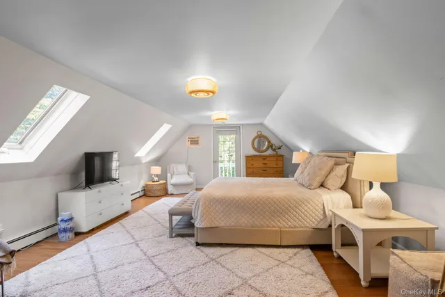 a bedroom with a bed and a table in it