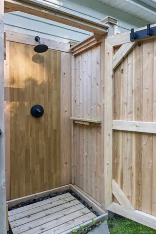 a view of backyard with outdoor seating and trees