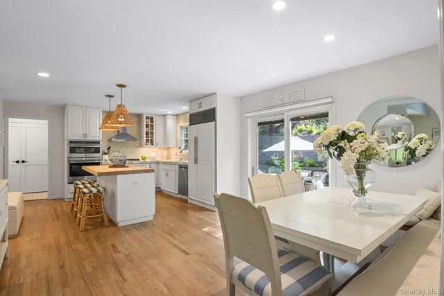a kitchen with stainless steel appliances granite countertop a sink and a stove