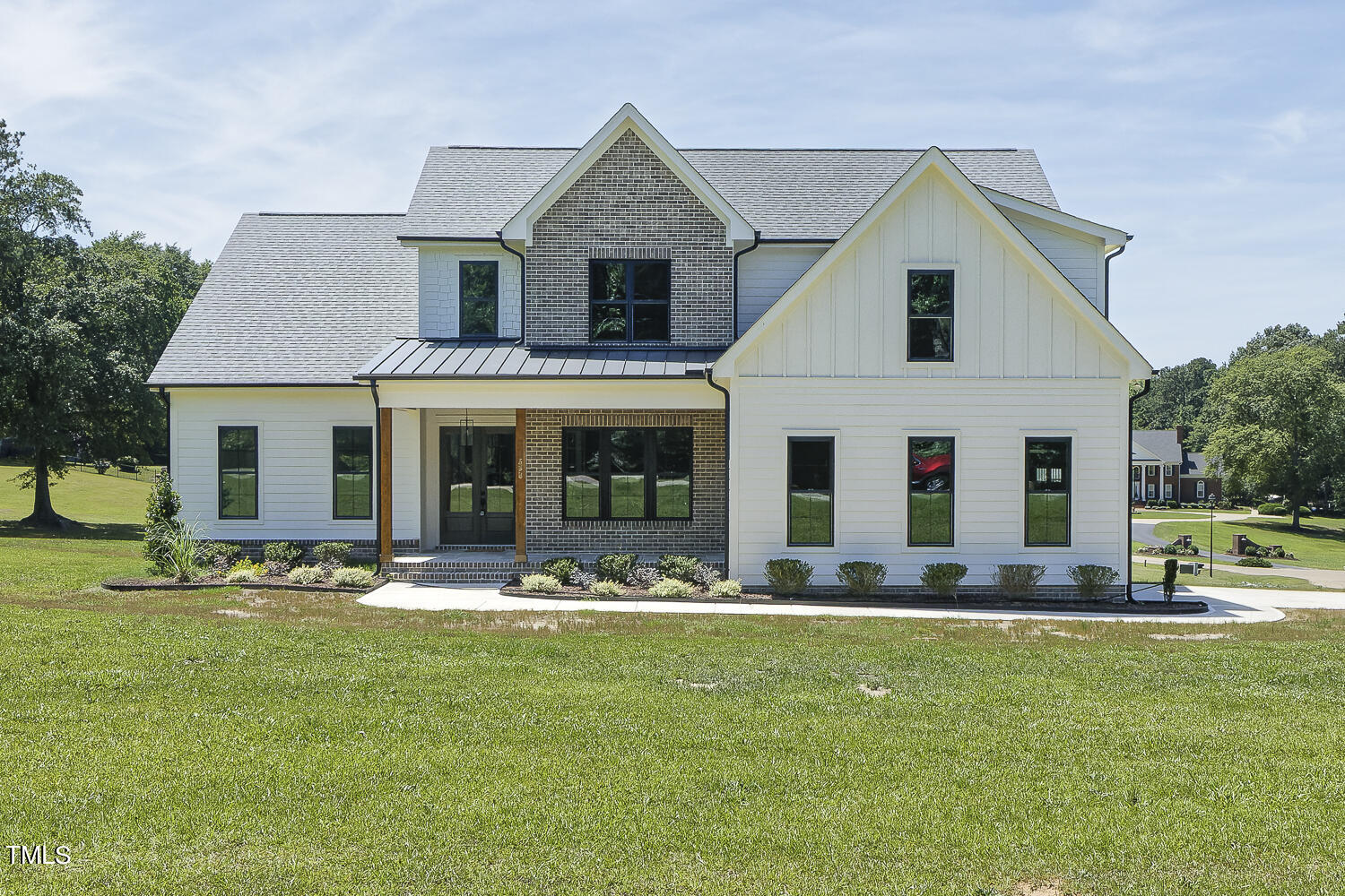 593 Pope Lake Road Angier, NC 27501 - Photo 1 of 48 a front view of a house with garden
