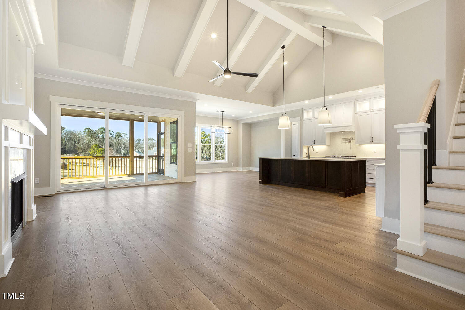 593 Pope Lake Road Angier, NC 27501 - Photo 11 of 48 an empty room with wooden floor and windows