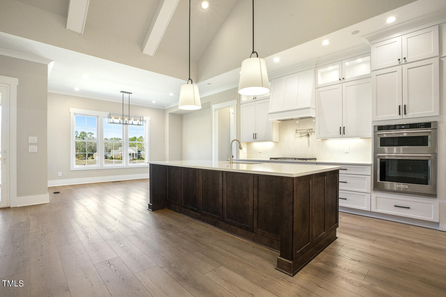 593 Pope Lake Road Angier, NC 27501 - Photo 19 of 48 a kitchen with stainless steel appliances kitchen island a cabinets and wooden floor